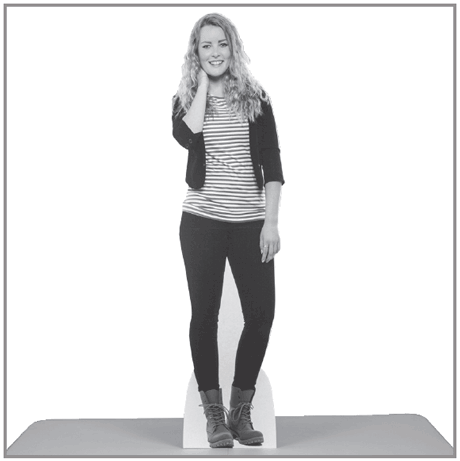 A full-body custom printed cutout of a woman standing independently, demonstrating the stability of the easel-back support system.